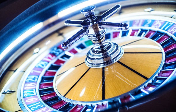 Dragon Tiger Live dealer studio showing dealer and card table from mobile perspective